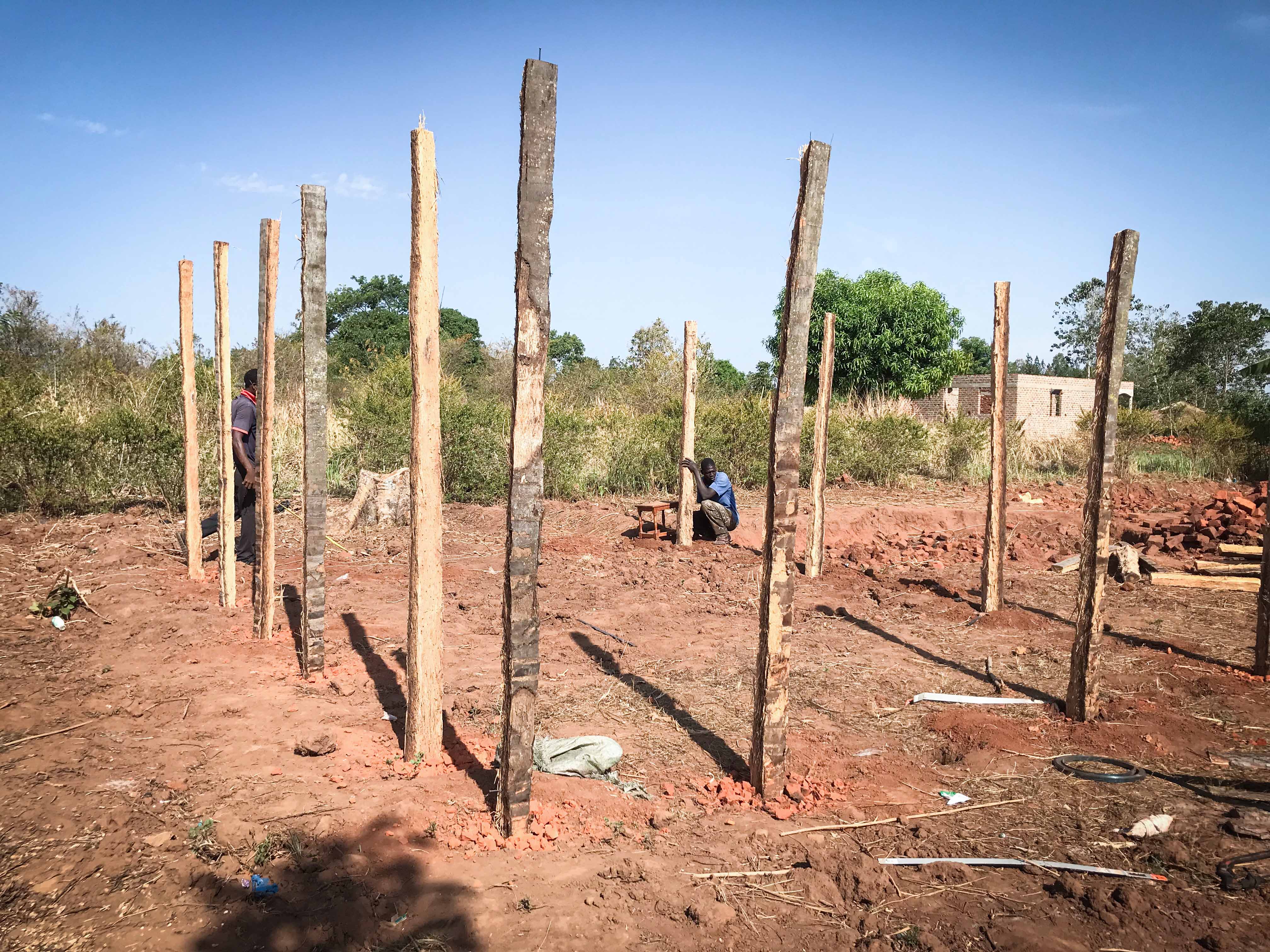 Community members laying the foundation for the maize milling house